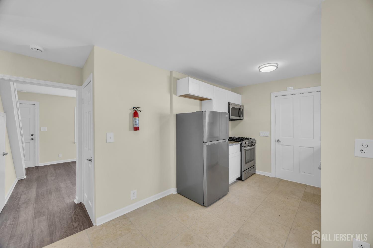 11 North Randolphville Road Piscataway, NJ 08854 - Photo 10 of 28 a view of kitchen with refrigerator and wooden floor