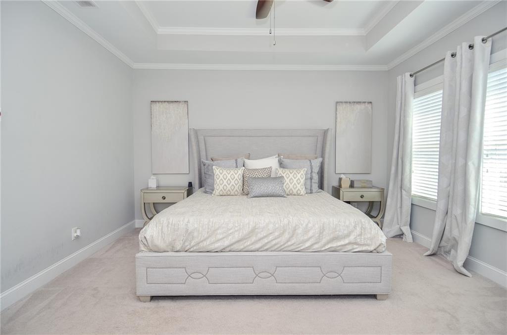 2143 Shale Lane Northwest Atlanta, GA 30318 - Photo 22 of 48 a spacious bedroom with a bed and a window
