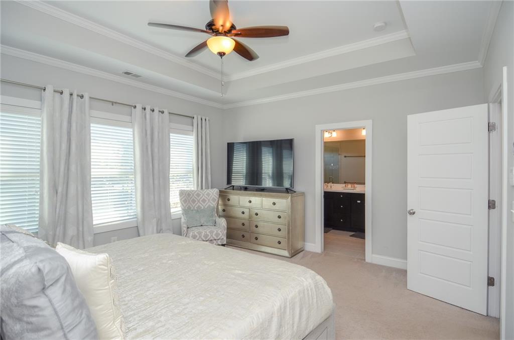 2143 Shale Lane Northwest Atlanta, GA 30318 - Photo 23 of 48 a bedroom with a bed and a flat screen tv