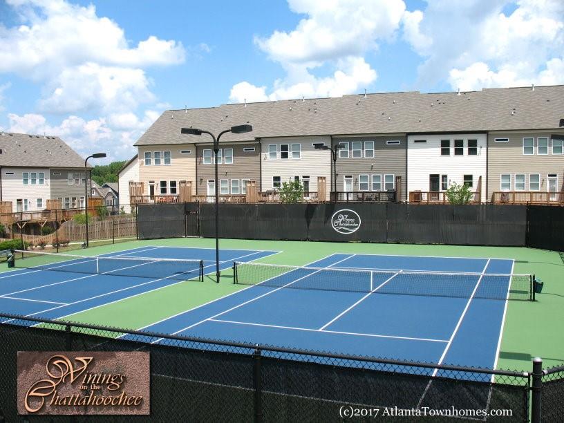 2143 Shale Lane Northwest Atlanta, GA 30318 - Photo 44 of 48 a tennis court that has a table and chairs in it