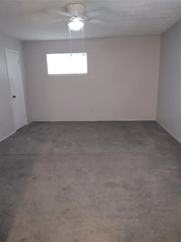 a bathroom with double vanity and a mirror