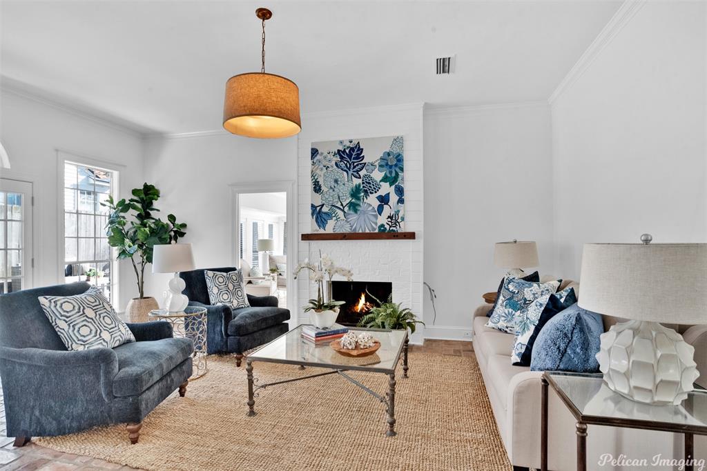 764 Delaware Street Shreveport, LA 71106 - Photo 1 of 1 a living room with furniture and a fireplace