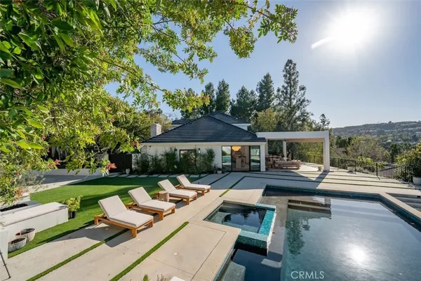 an outdoor view of the patio and swimming pool