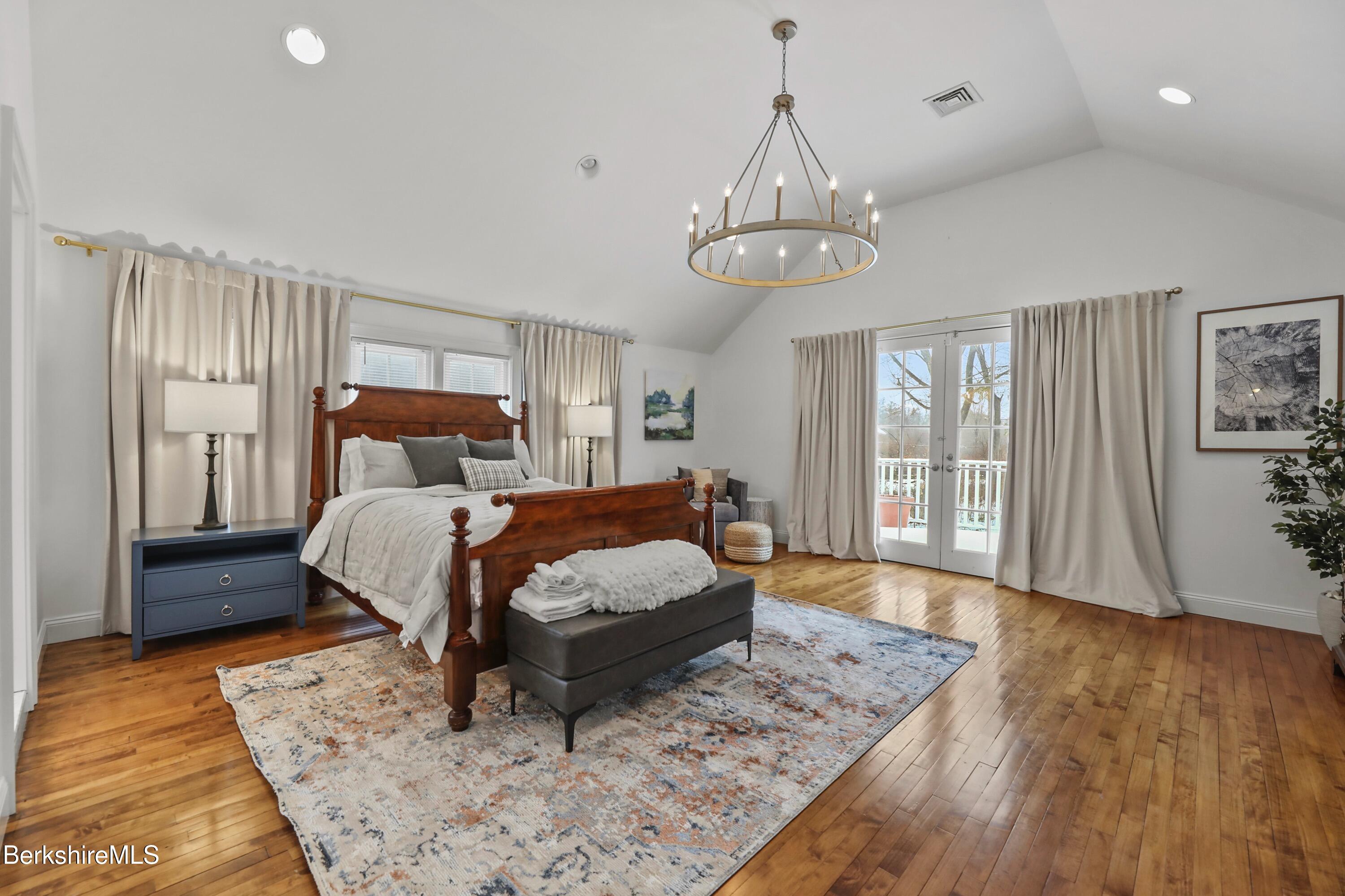 1 Devon Road Stockbridge, MA 01262 - Photo 35 of 58 a bedroom with a bed and wooden floor