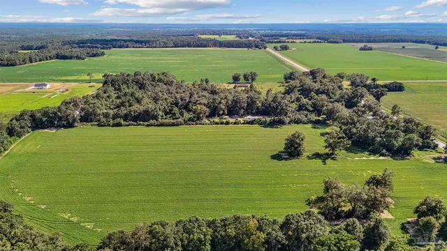 a view of a golf course with a building