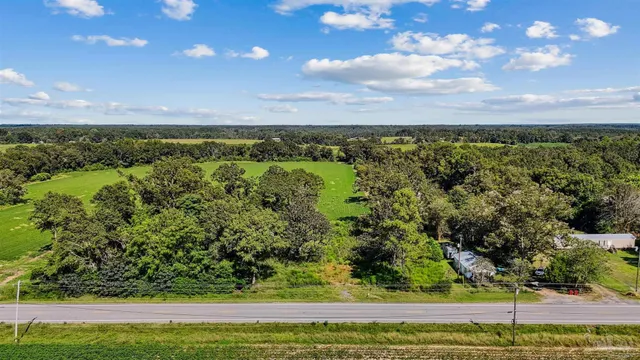 a view of a yard with an outdoor seating