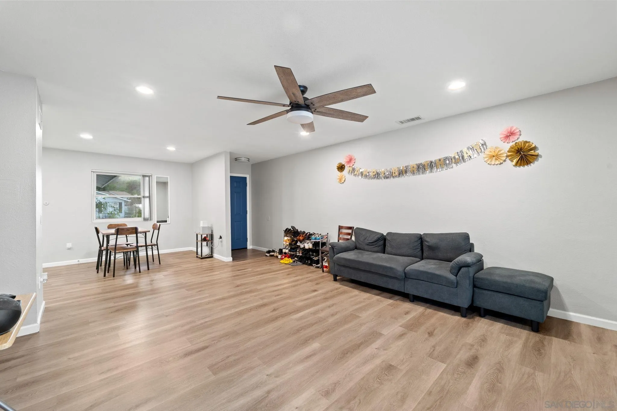 337 Osage Street Spring Valley, CA 91977 - Photo 11 of 19 a living room with furniture and a wooden floor