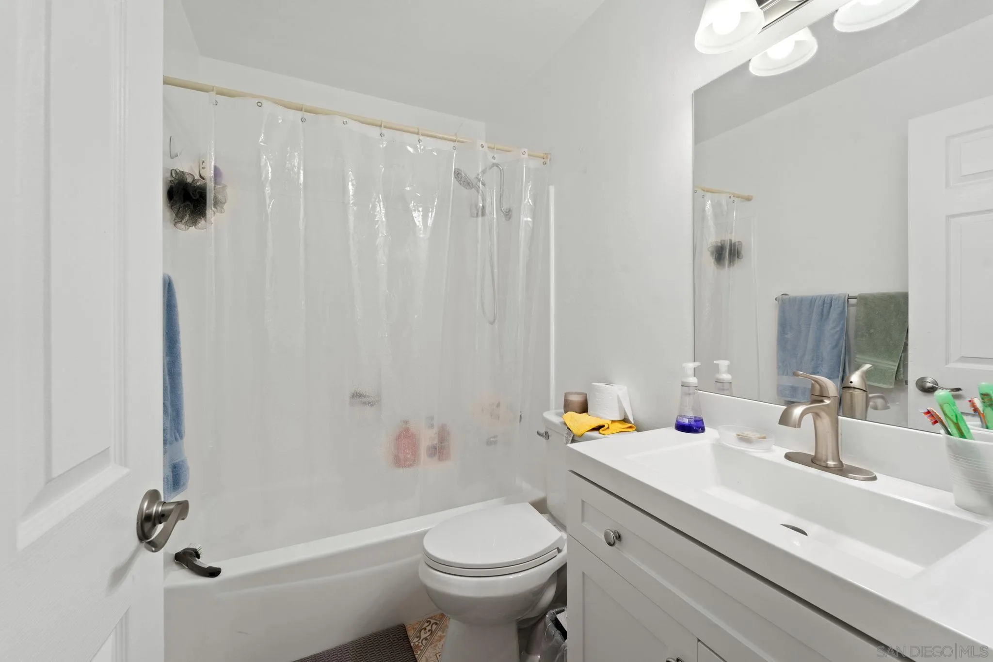 337 Osage Street Spring Valley, CA 91977 - Photo 13 of 19 a bathroom with a sink toilet and shower