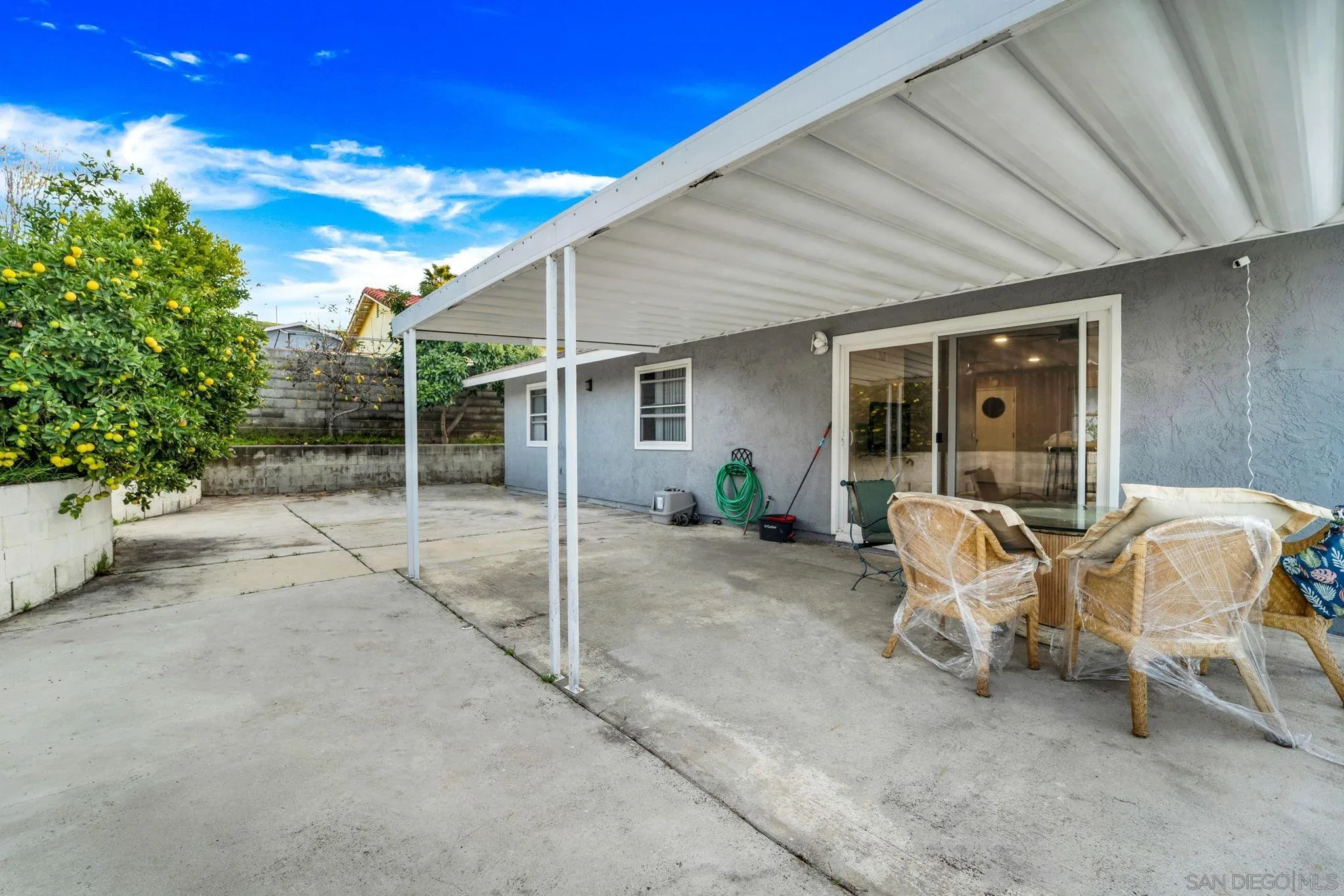 337 Osage Street Spring Valley, CA 91977 - Photo 14 of 19 a backyard of a house with table and chairs