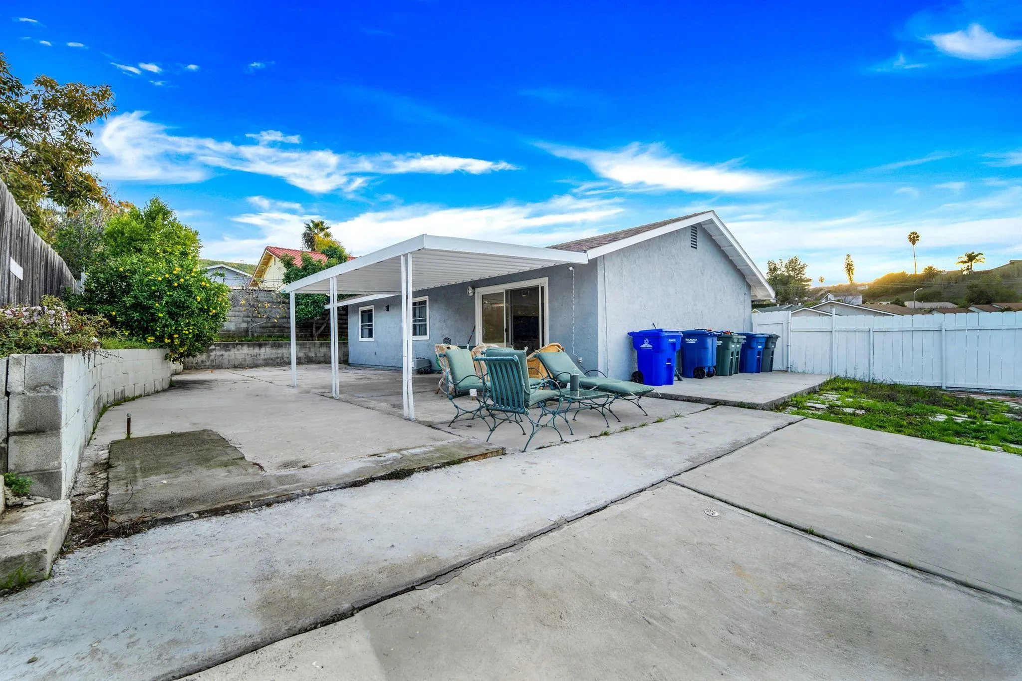 337 Osage Street Spring Valley, CA 91977 - Photo 2 of 19 a view of a white house with a yard and plants