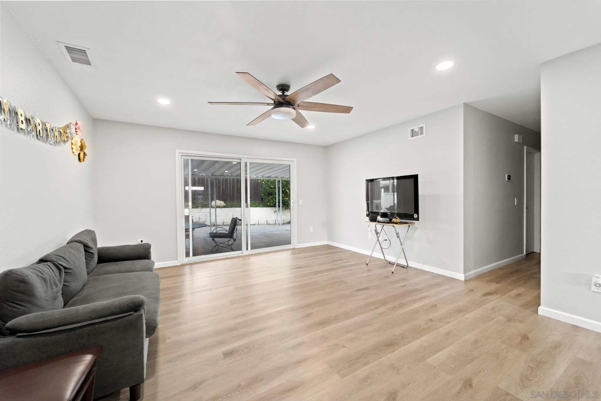 337 Osage Street Spring Valley, CA 91977 - Photo 3 of 19 a living room with furniture and a flat screen tv