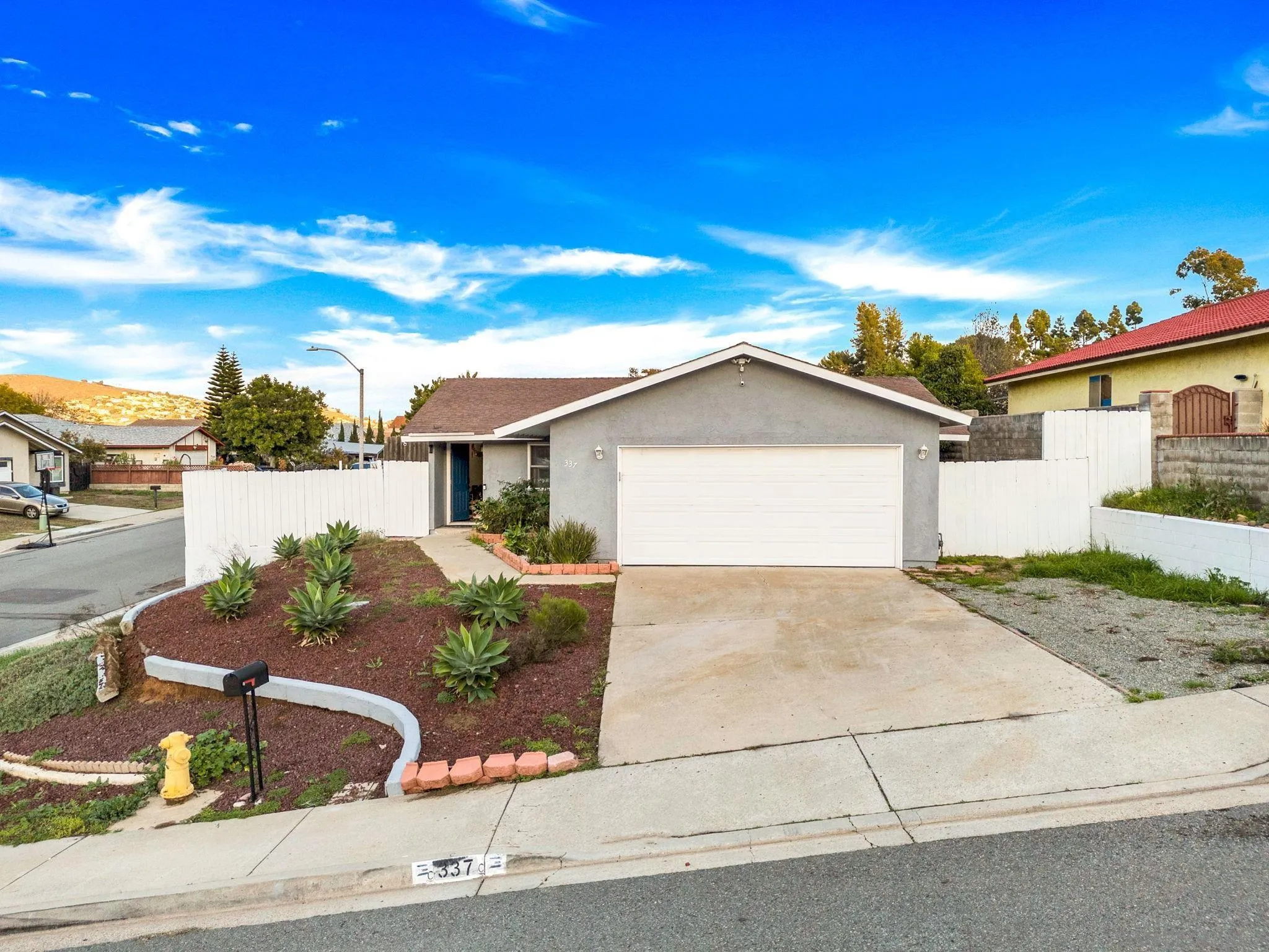 337 Osage Street Spring Valley, CA 91977 - Photo 5 of 19 a view of a house with backyard and sitting area