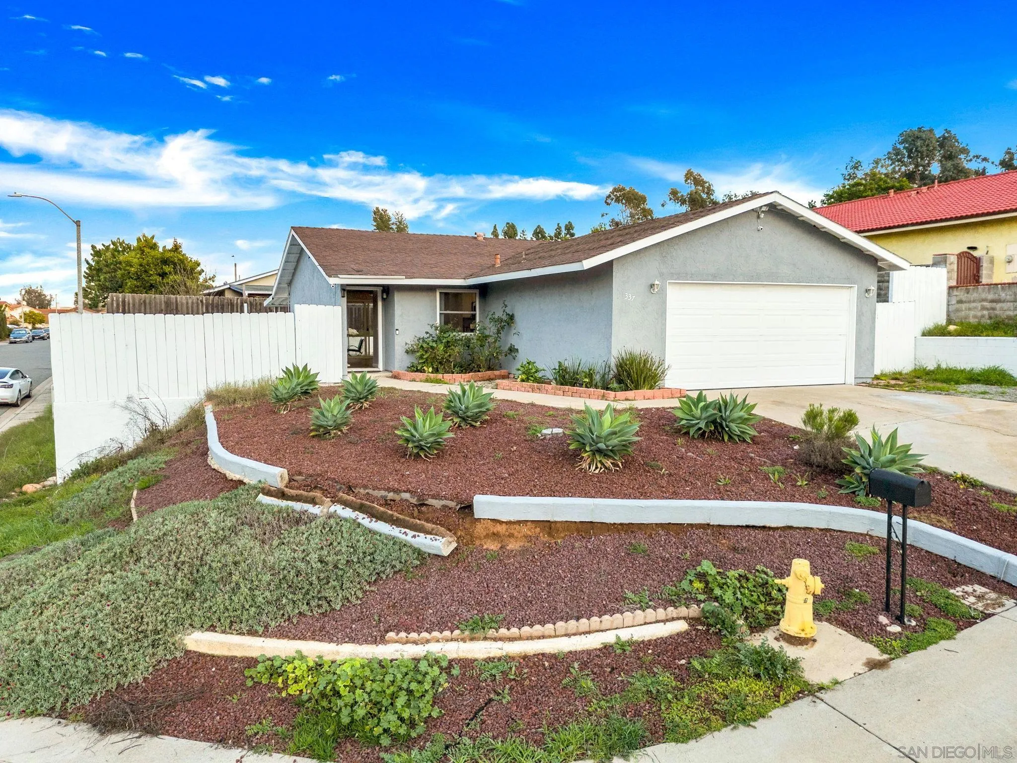 337 Osage Street Spring Valley, CA 91977 - Photo 6 of 19 a front view of a house with garden