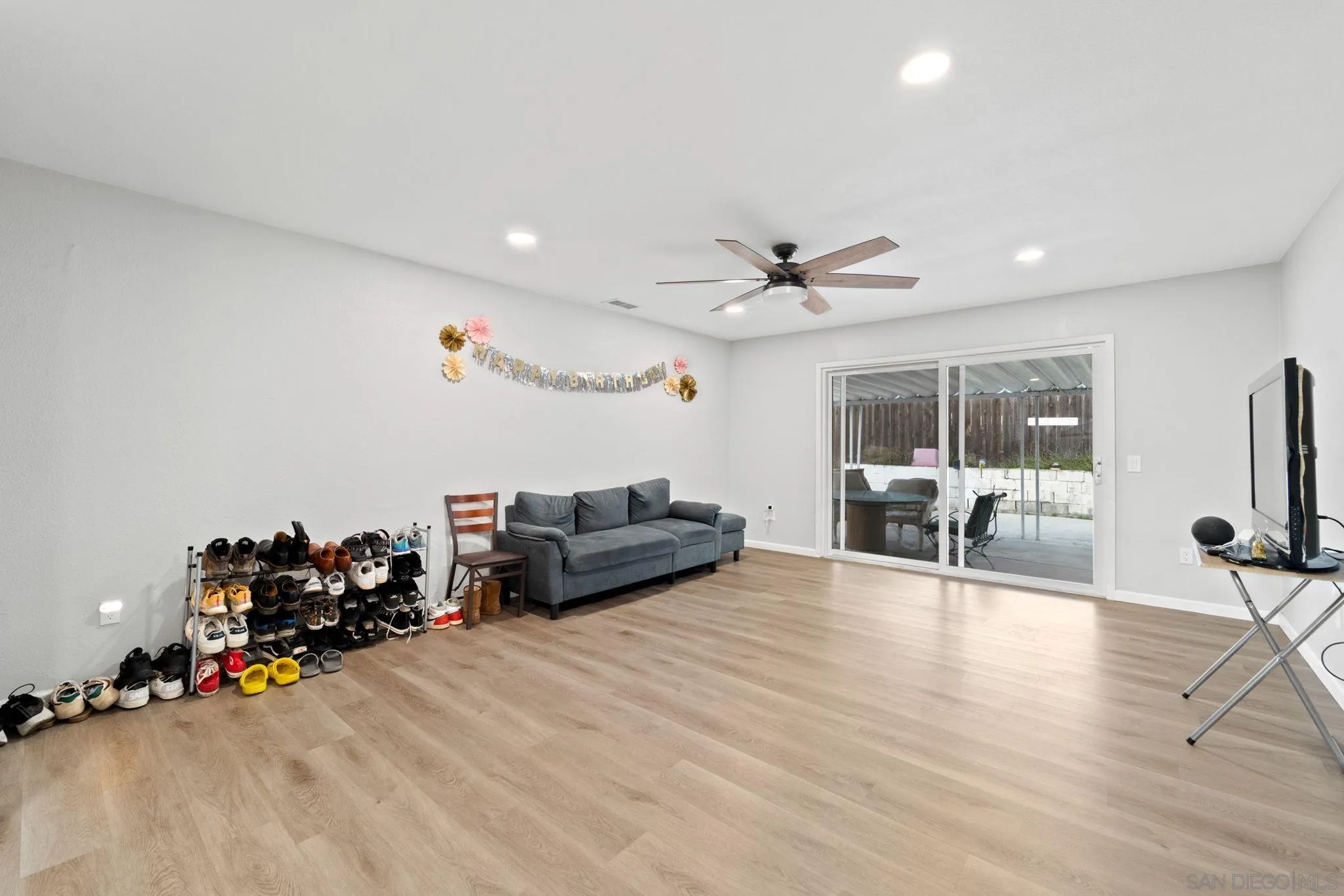 337 Osage Street Spring Valley, CA 91977 - Photo 10 of 19 a living room with furniture and a flat screen tv