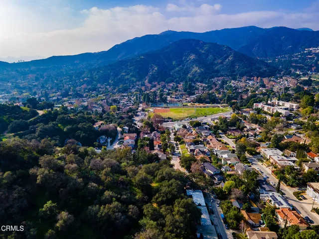 a view of a city with mountains in the background