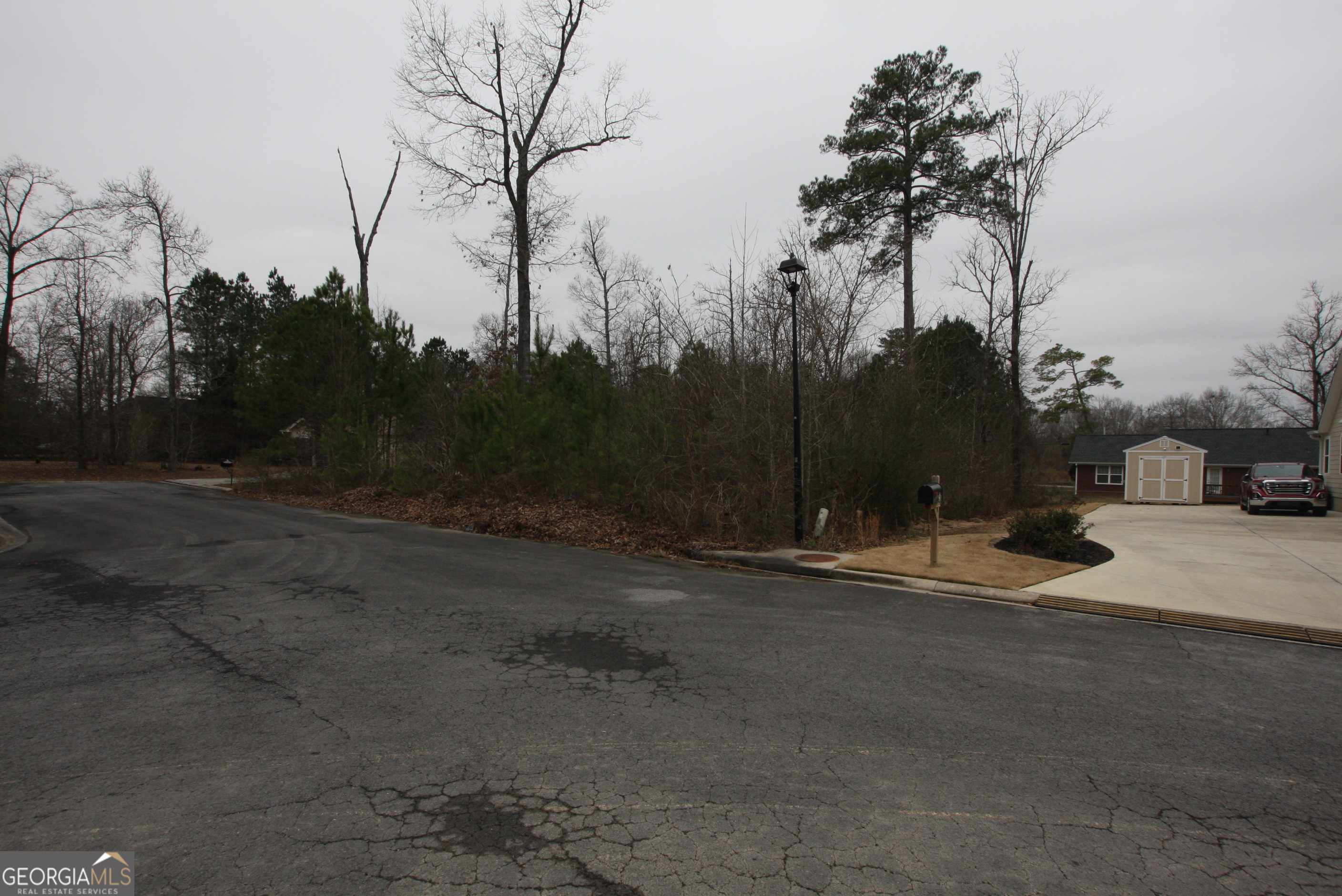0 Spanish Oaks Trail Rome, GA 30165 - Photo 4 of 7 a backyard of a house with lots of green space and trees