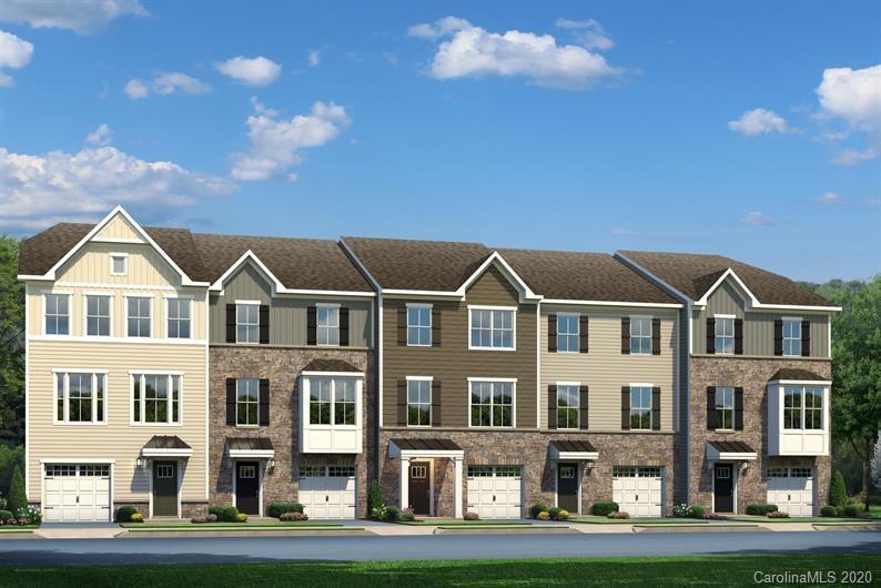 910 Portrush Lane, Unit 1015B Tega Cay, SC 29708 - Photo 1 of 8 a front view of residential houses with street view