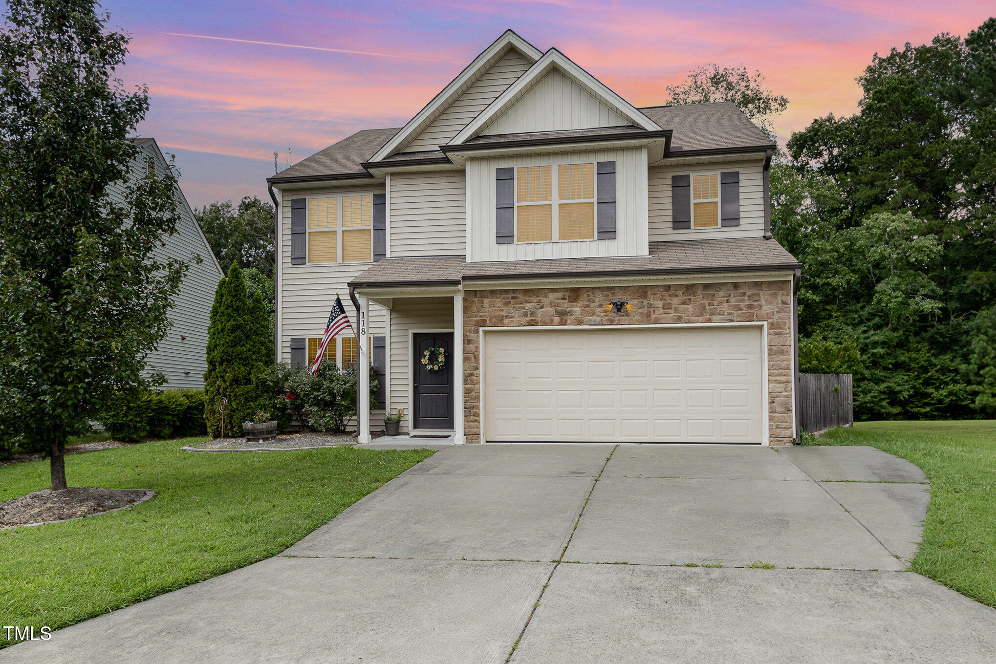 118 Truss Way Durham, NC 27704 - Photo 1 of 27 a front view of a house with yard and garage