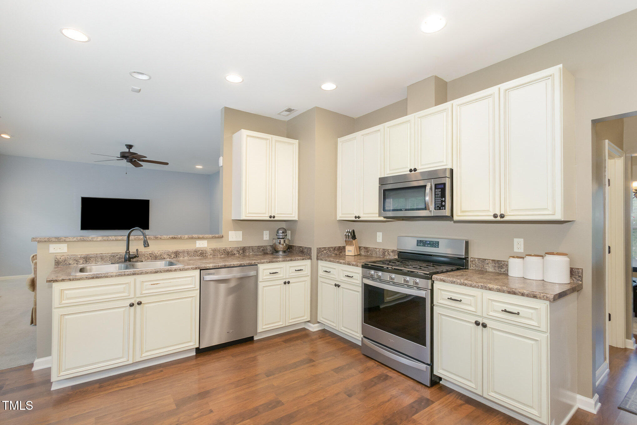 118 Truss Way Durham, NC 27704 - Photo 12 of 27 a kitchen with a sink stove and white cabinets