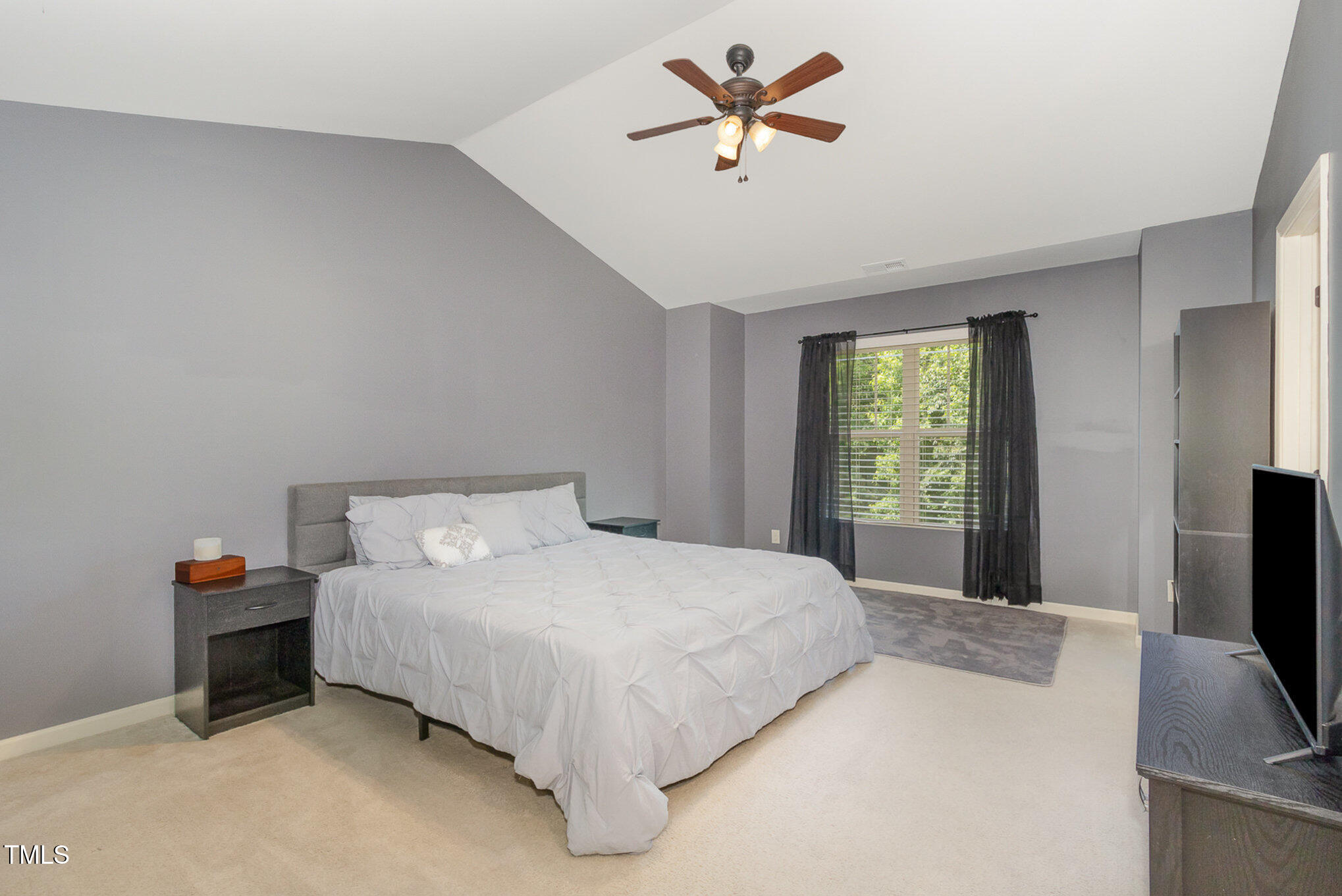 118 Truss Way Durham, NC 27704 - Photo 17 of 27 a bedroom with a bed and a flat screen tv