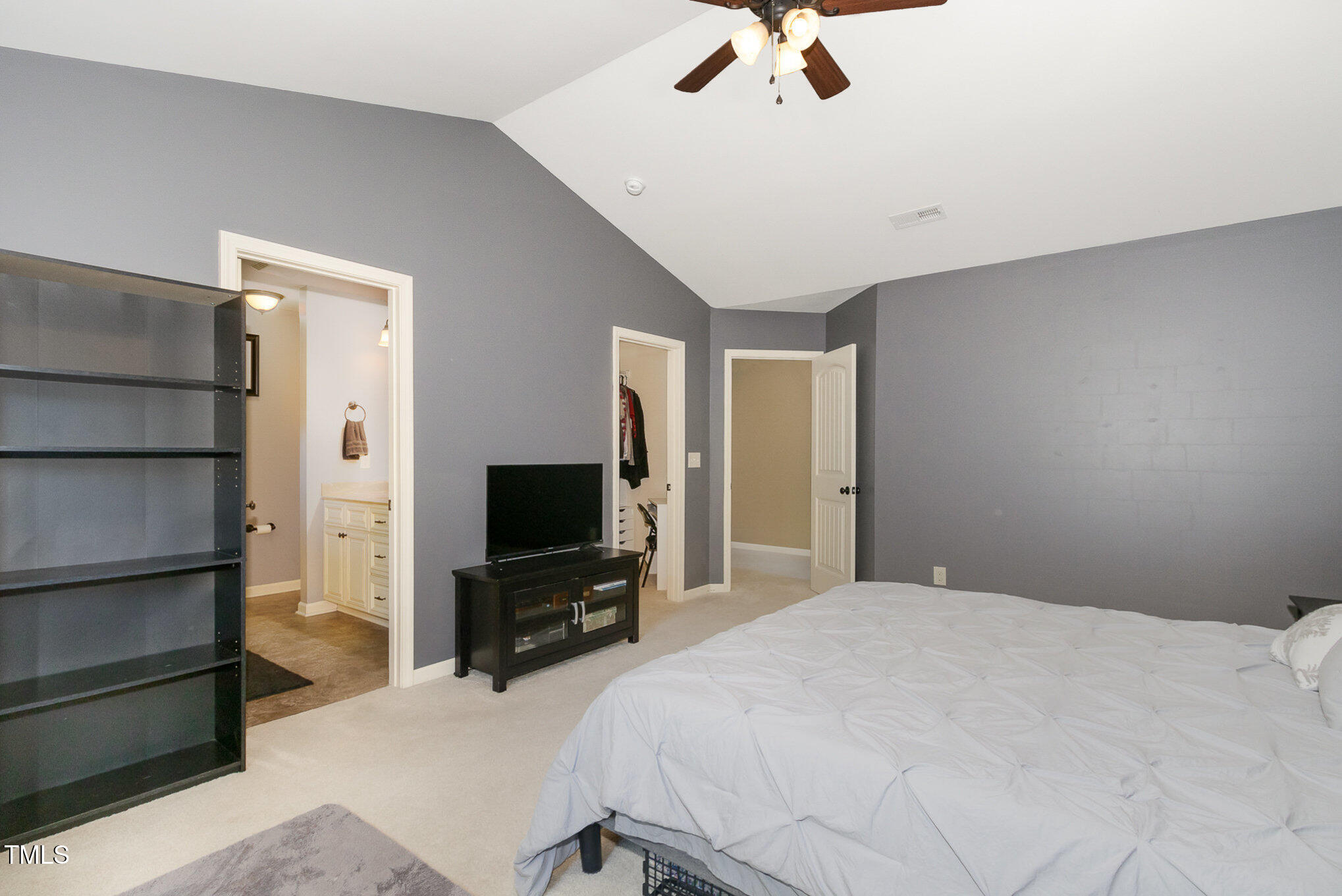 118 Truss Way Durham, NC 27704 - Photo 18 of 27 a bedroom with a bed and a flat screen tv