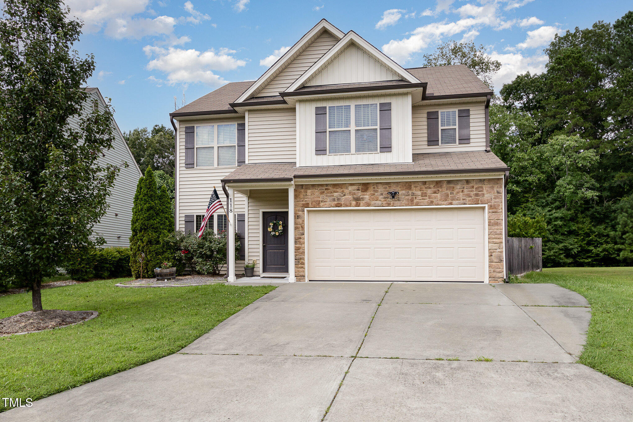 118 Truss Way Durham, NC 27704 - Photo 2 of 27 a front view of a house with a yard and garage