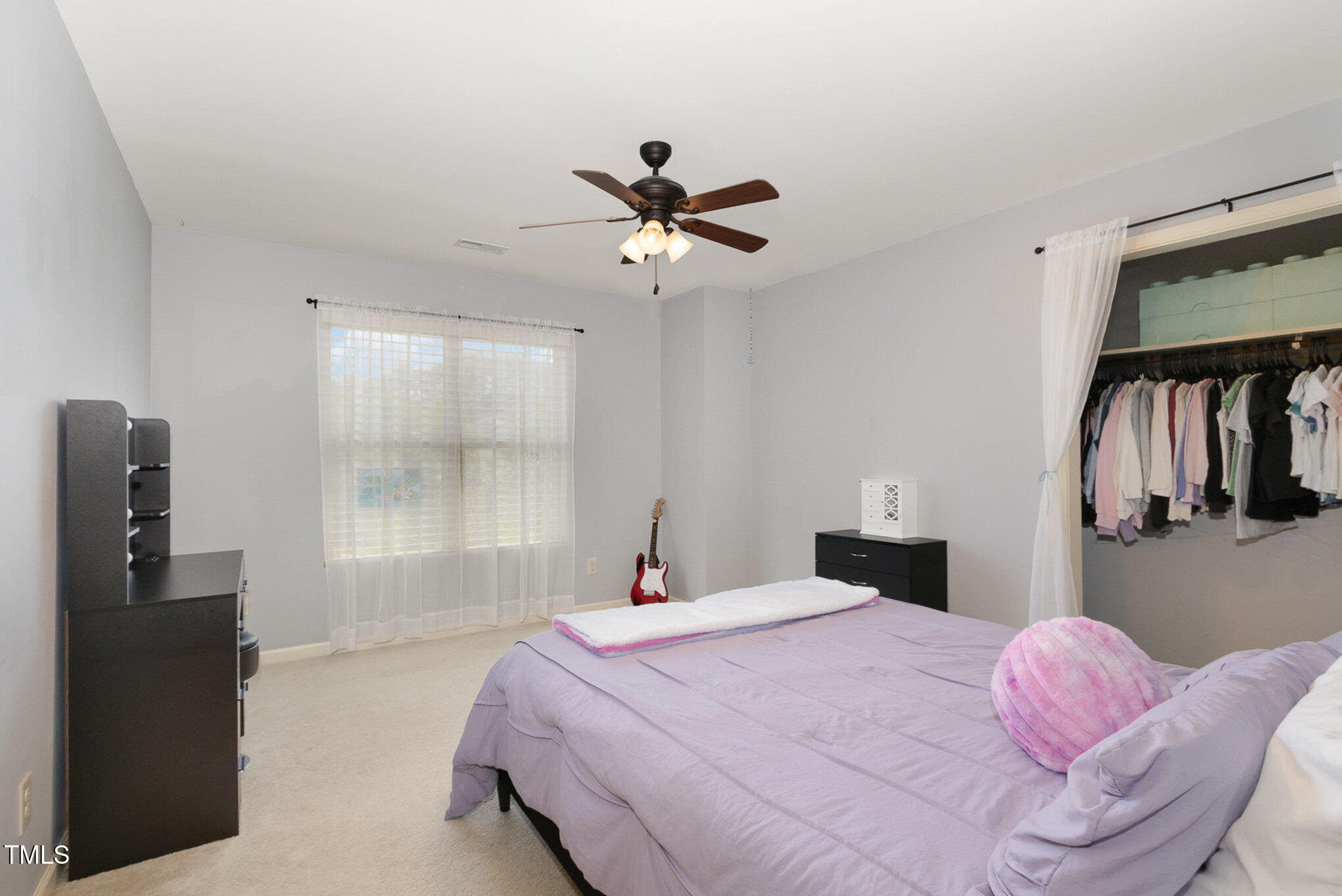 118 Truss Way Durham, NC 27704 - Photo 22 of 27 a bedroom with a bed and dresser