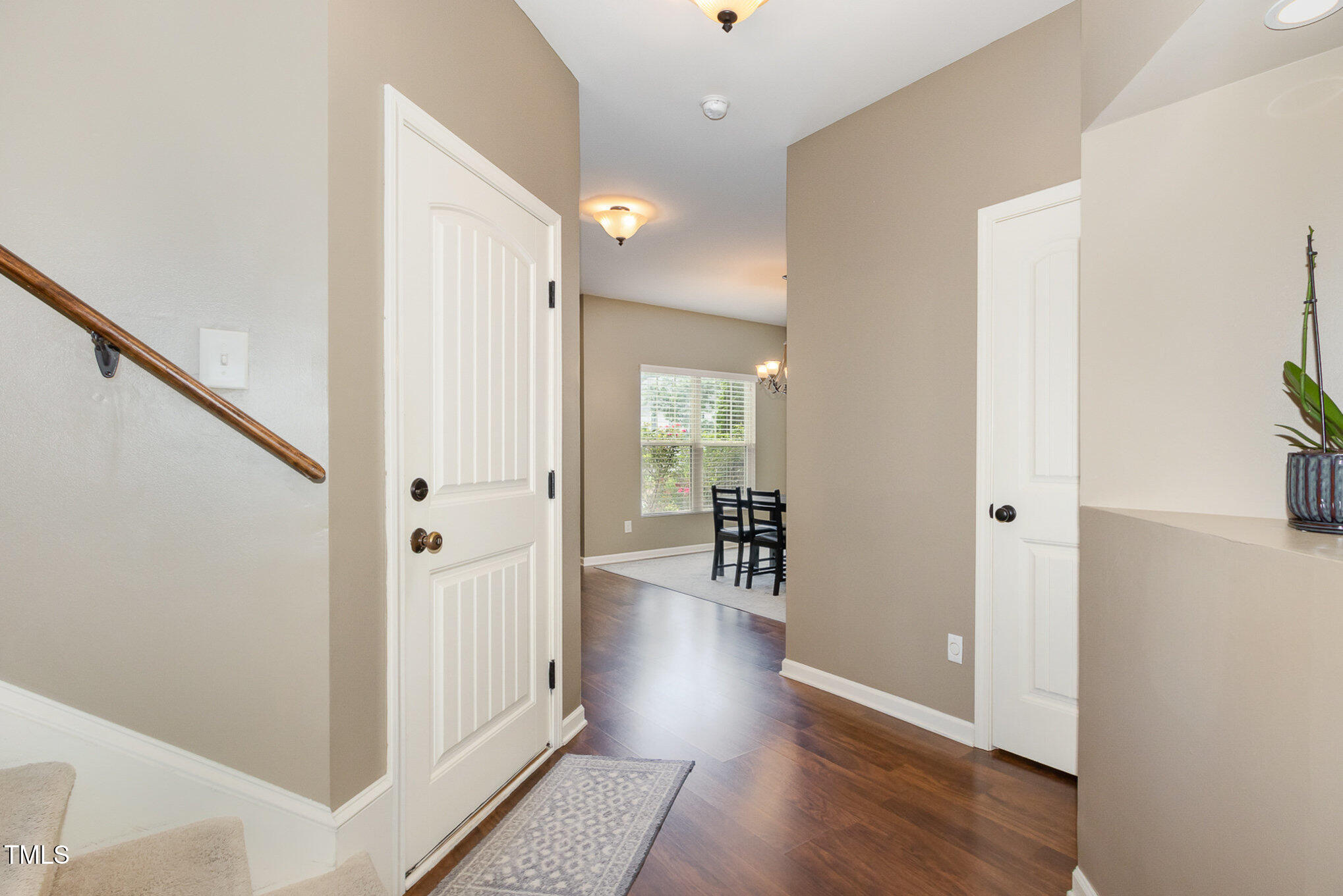 118 Truss Way Durham, NC 27704 - Photo 4 of 27 a view of a hallway with wooden floor and staircase