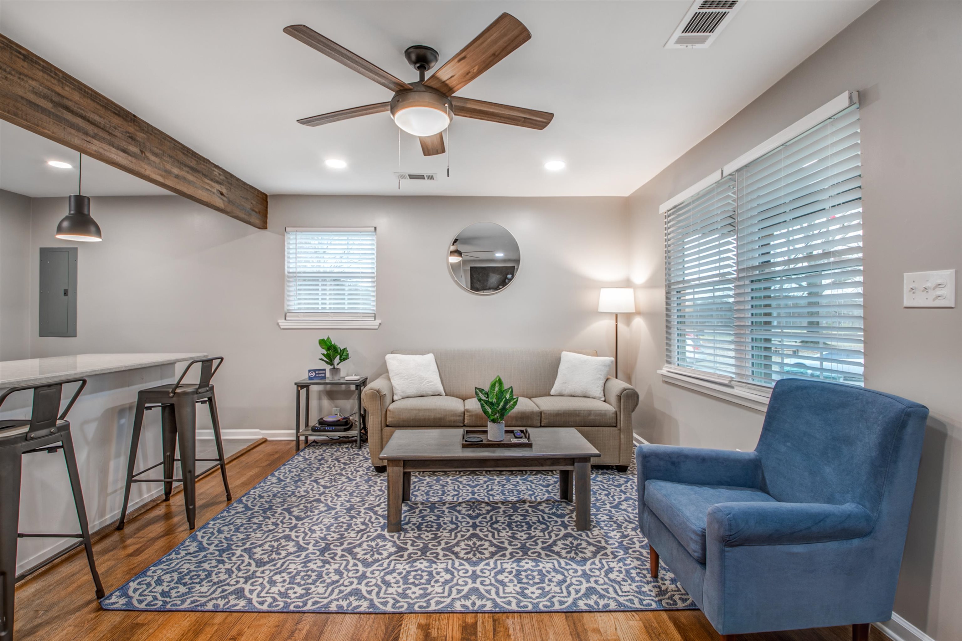 1277 Wellsville Road Memphis, TN 38117 - Photo 11 of 39 Living room with dark wood finished floors, recessed lighting, a ceiling fan, electric panel, and beam ceiling
