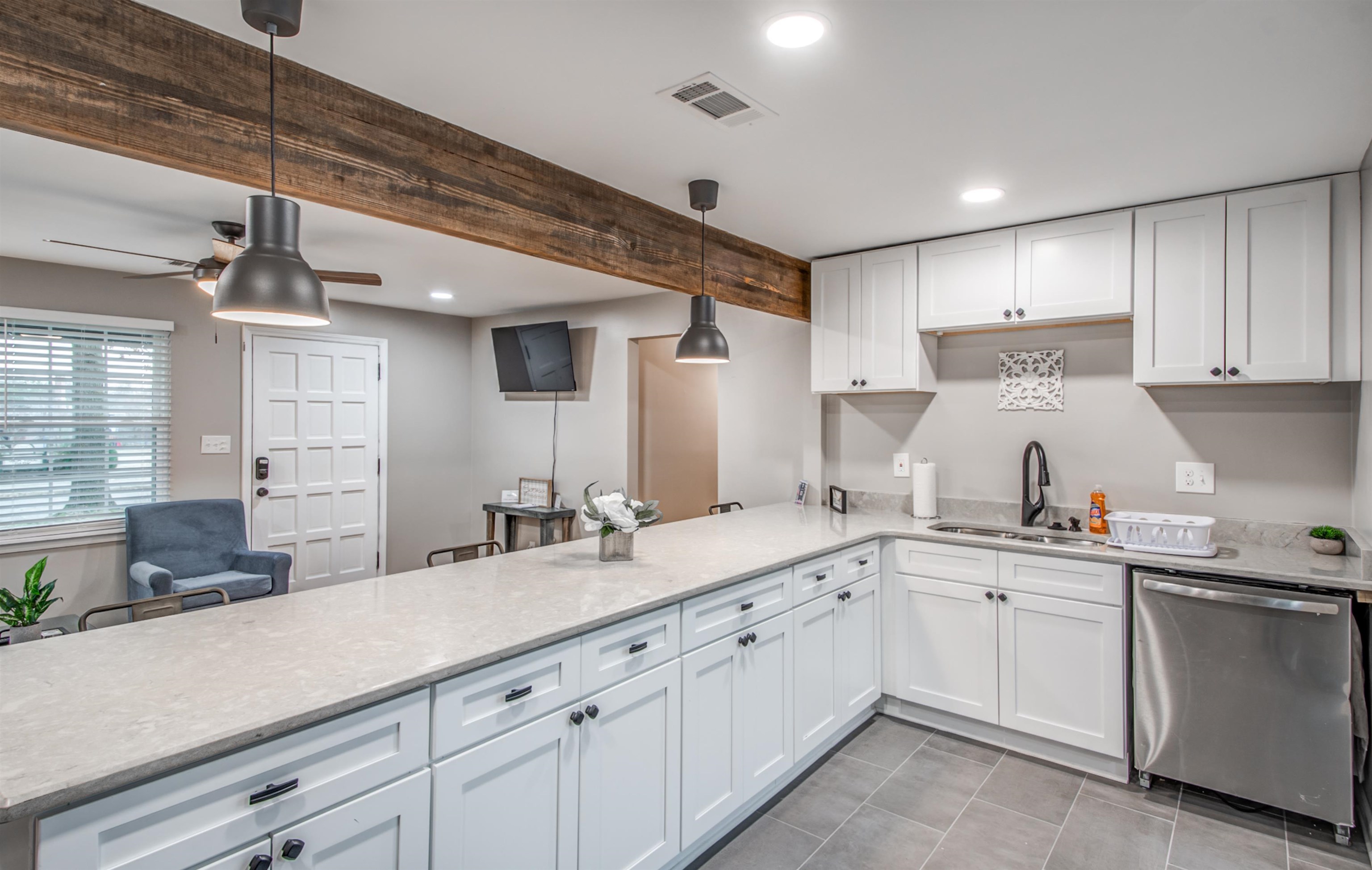 1277 Wellsville Road Memphis, TN 38117 - Photo 2 of 39 a kitchen with a sink and cabinets