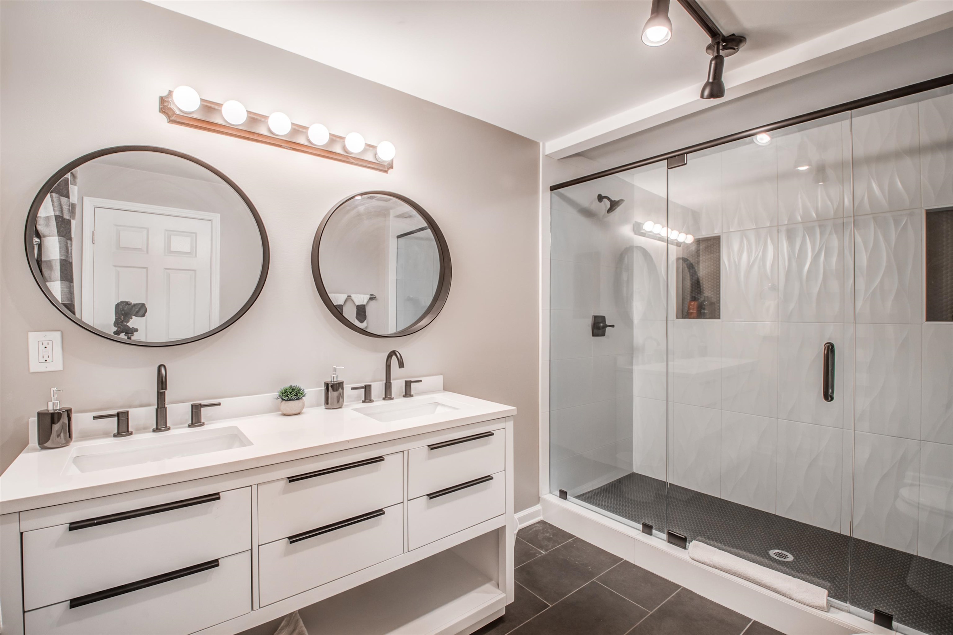 1277 Wellsville Road Memphis, TN 38117 - Photo 30 of 39 a bathroom with a double vanity sink mirror and shower
