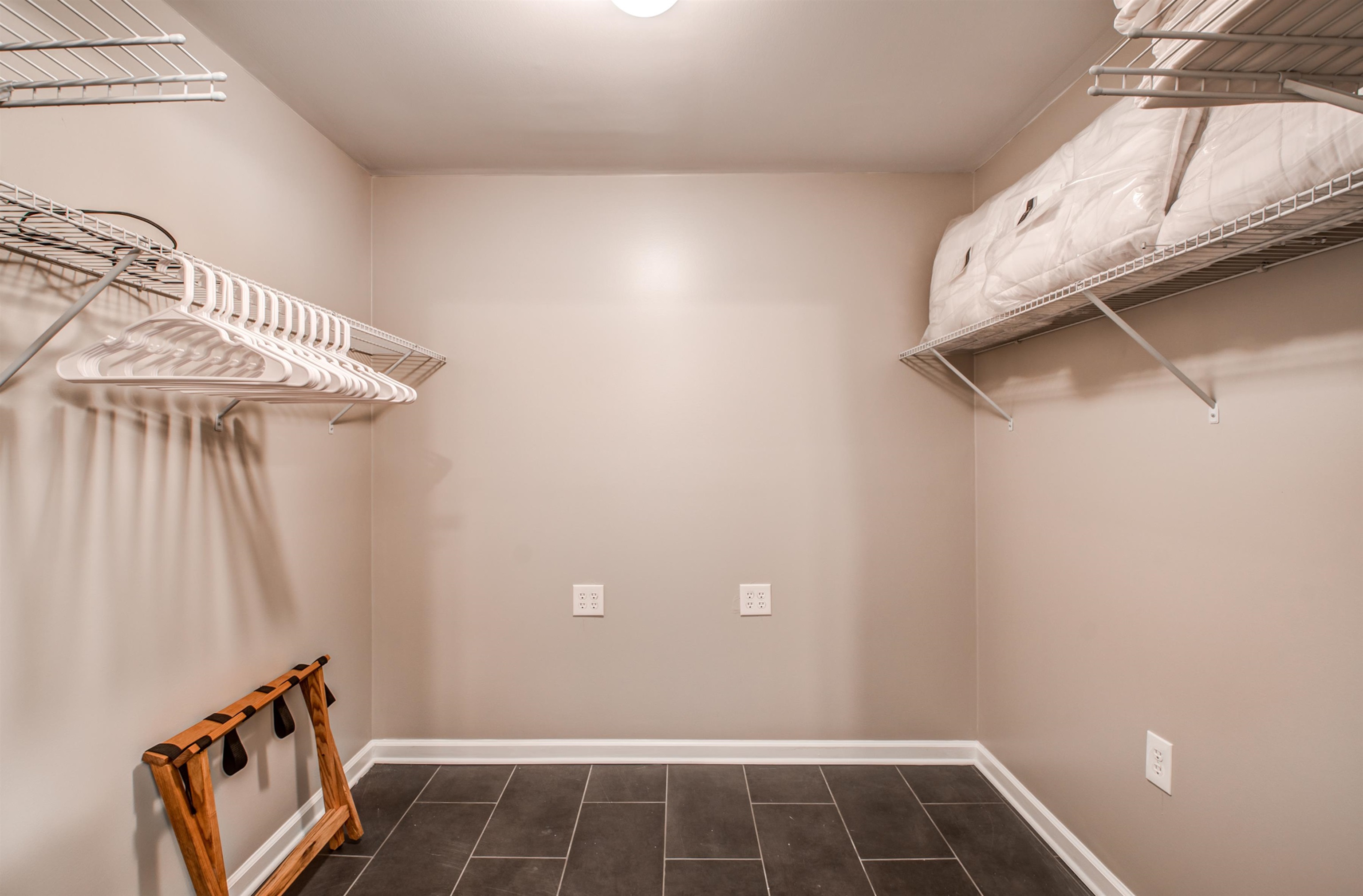 1277 Wellsville Road Memphis, TN 38117 - Photo 33 of 39 a view of walk in closet with clothes and shoes