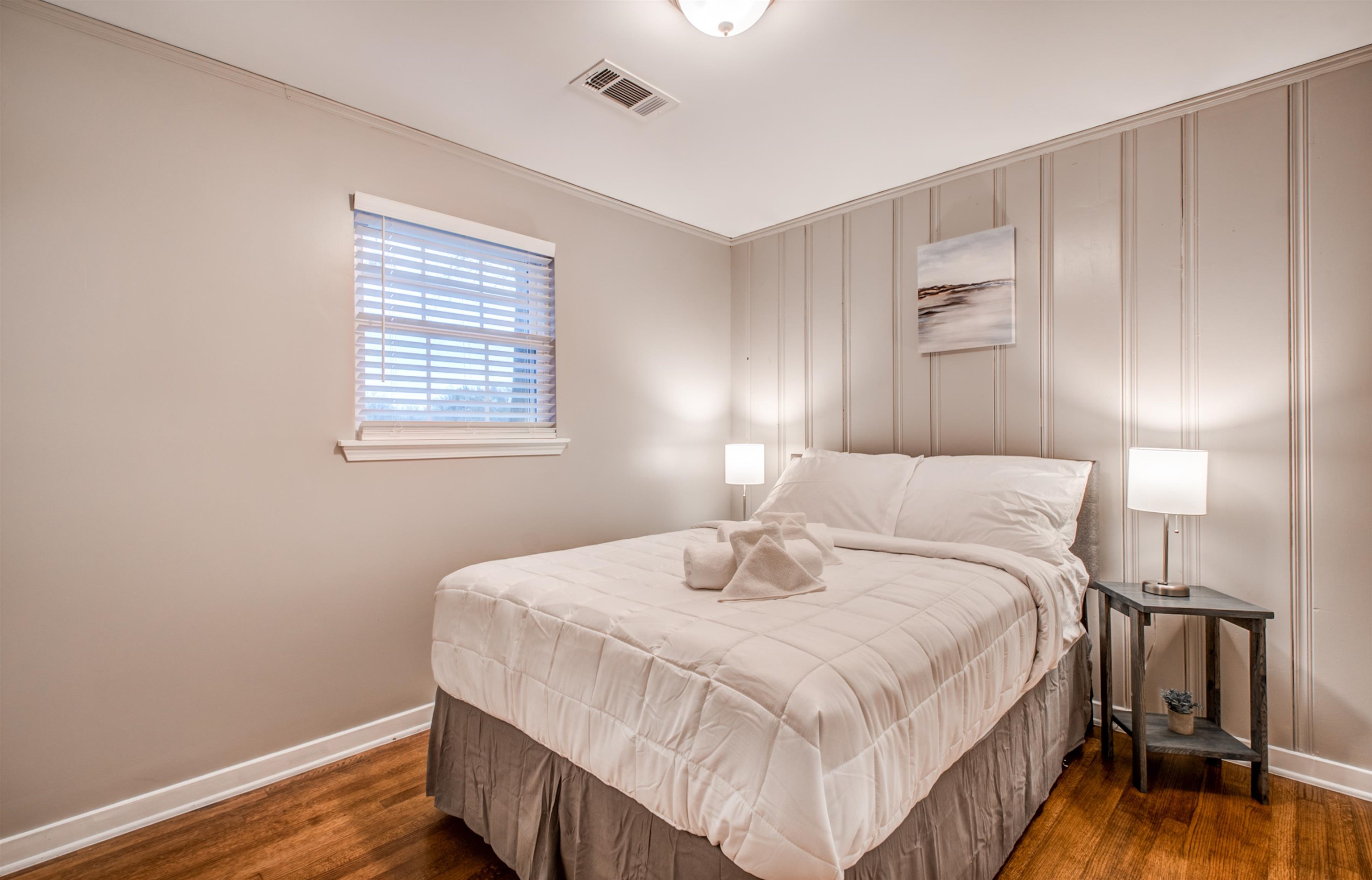 1277 Wellsville Road Memphis, TN 38117 - Photo 34 of 39 a bedroom with a bed and wooden floor