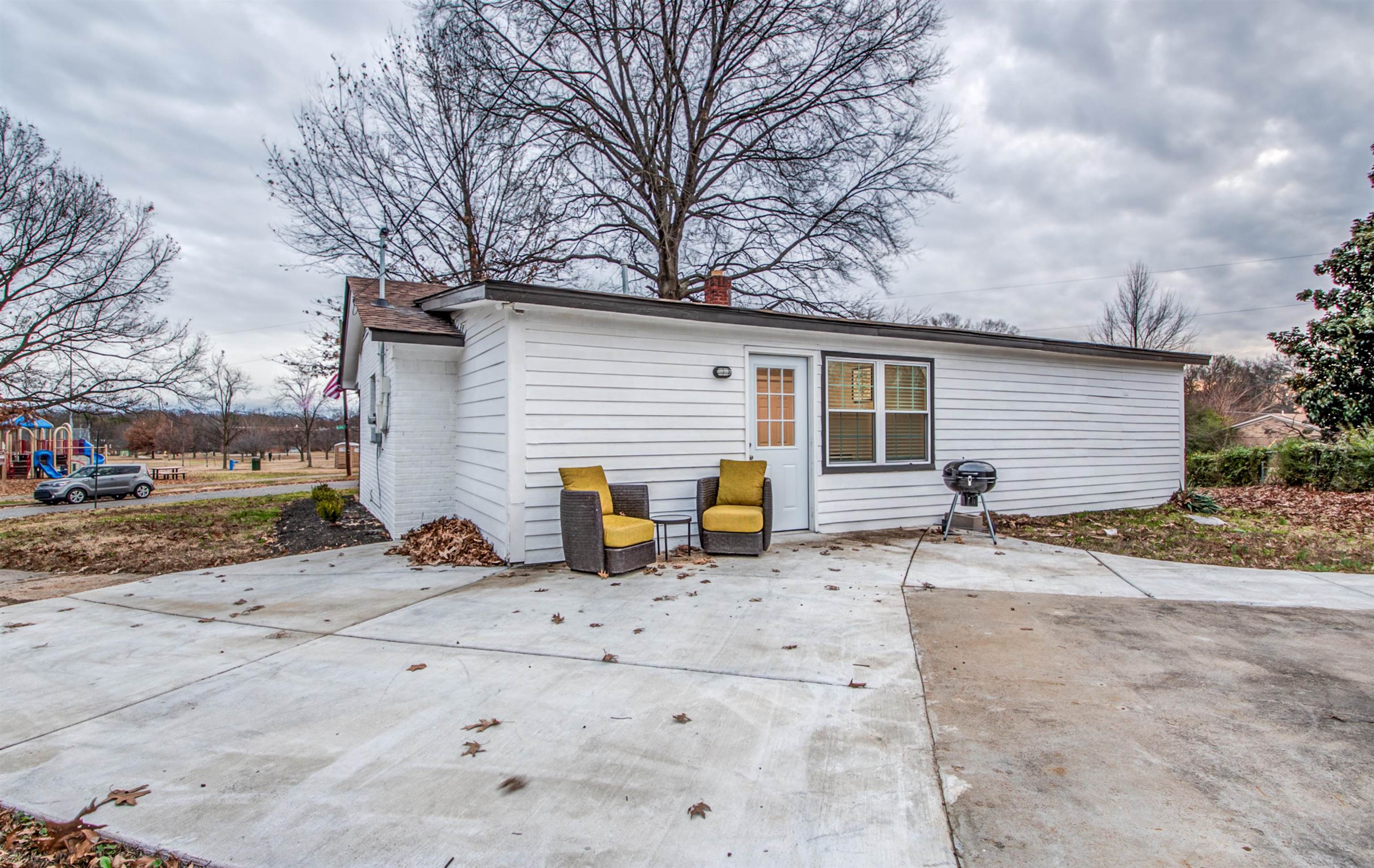 1277 Wellsville Road Memphis, TN 38117 - Photo 7 of 39 Rear view of house with a patio and a chimney