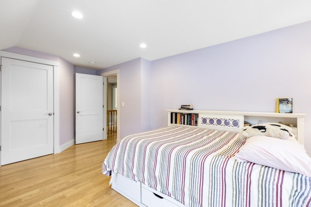 20 Richard Road Lexington, MA 02421 - Photo 18 of 28 a bedroom with a bed and a night stand