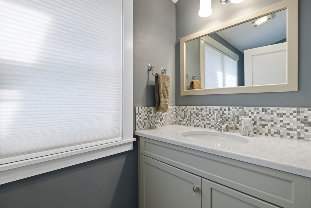 20 Richard Road Lexington, MA 02421 - Photo 21 of 28 a bathroom with a sink and a mirror