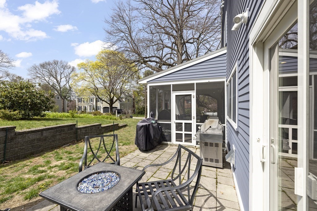 20 Richard Road Lexington, MA 02421 - Photo 24 of 28 a view of a patio with couches table and chairs and potted plants