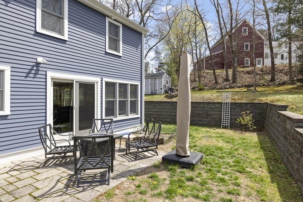 20 Richard Road Lexington, MA 02421 - Photo 25 of 28 a view of a house with backyard sitting area and garden