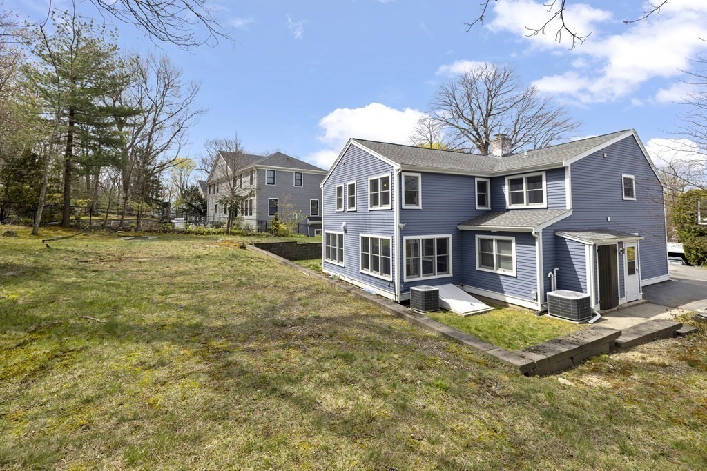 20 Richard Road Lexington, MA 02421 - Photo 27 of 28 a view of a house with a big yard and large trees
