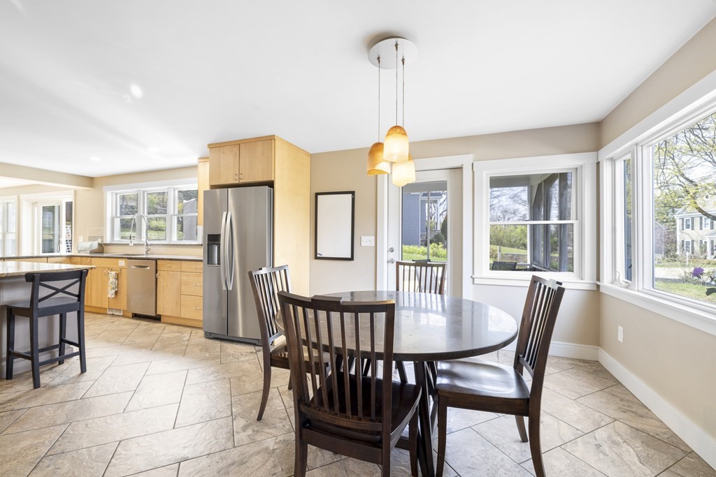 20 Richard Road Lexington, MA 02421 - Photo 8 of 28 a view of a dining room and livingroom with furniture wooden floor a chandelier