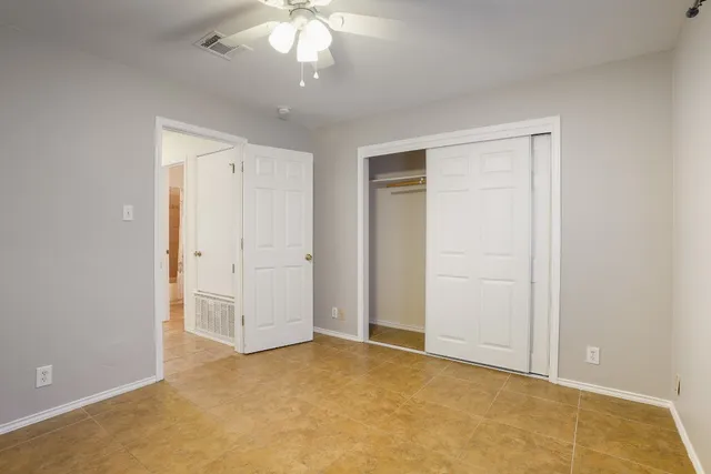 an empty room with a bathroom