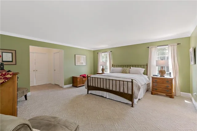 a bedroom with a bed and a cabinets