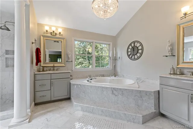 a bathroom with a sink and a large mirror