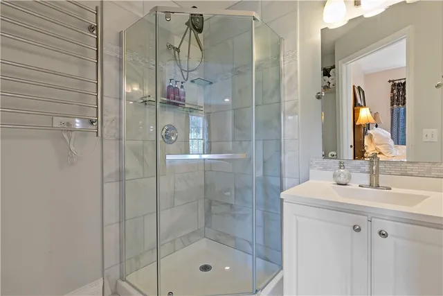 a bathroom with a shower and a sink
