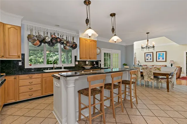 a large kitchen with a table and chairs in it