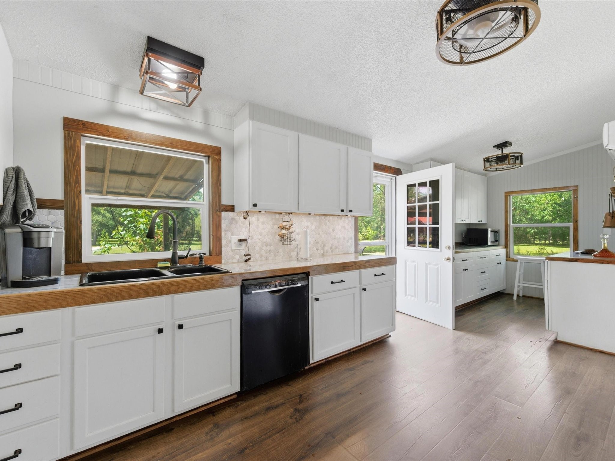 27855 Kresdorn Road Hockley, TX 77447 - Photo 6 of 24 a kitchen with sink cabinets and window