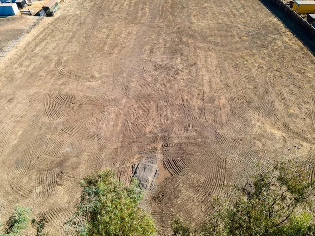an aerial view of residential building and ocean
