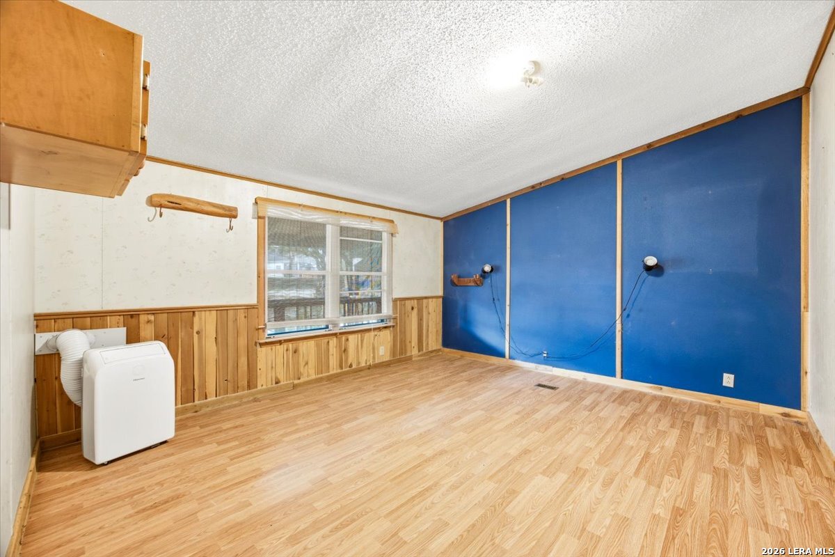 176 Golden Meadows Cibolo, TX 78108 - Photo 12 of 28 a bedroom with a bed and window