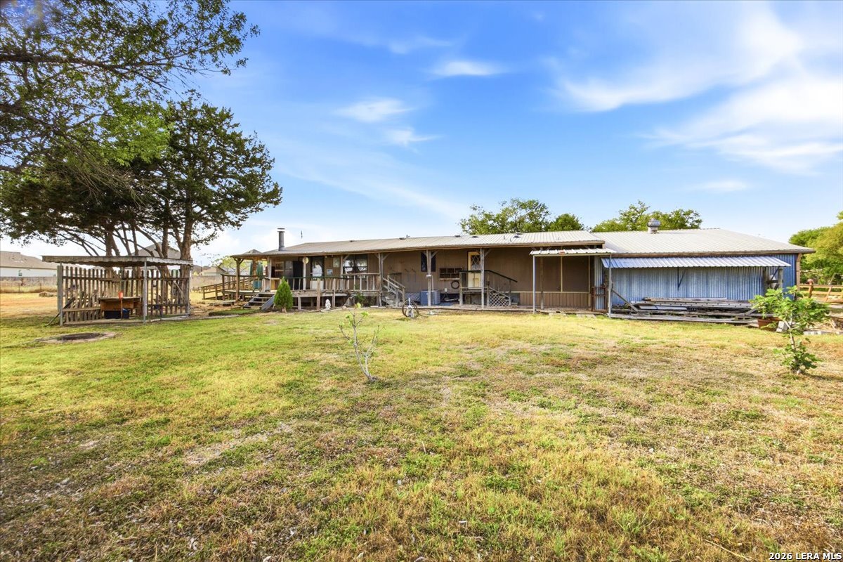 176 Golden Meadows Cibolo, TX 78108 - Photo 17 of 28 a front view of a house with a garden