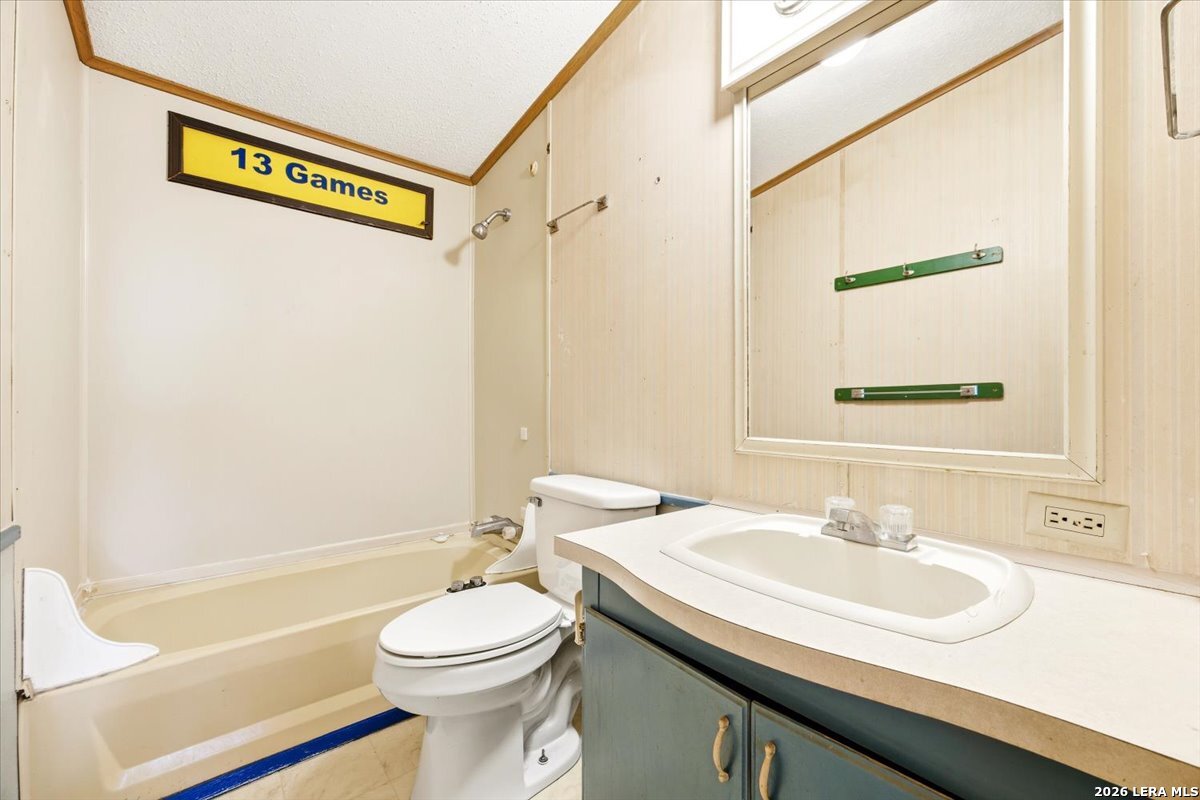 176 Golden Meadows Cibolo, TX 78108 - Photo 10 of 28 a bathroom with a sink a toilet and a bathtub